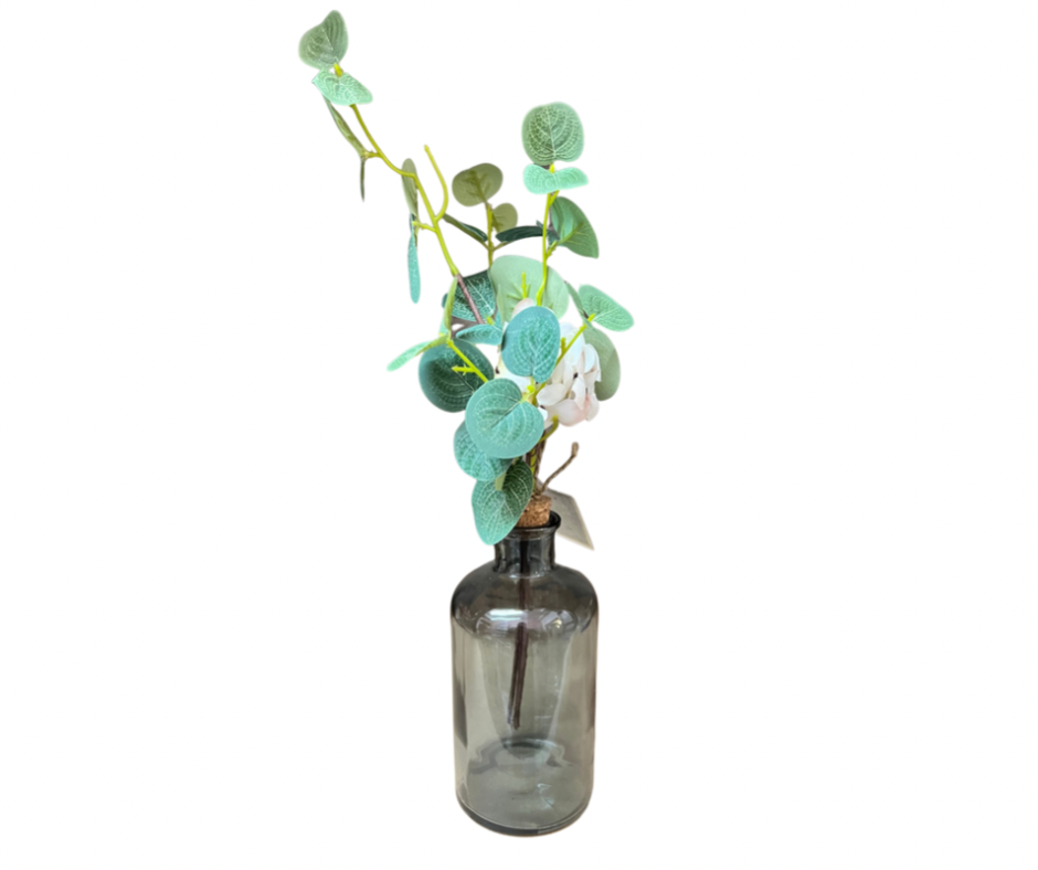 Eucalyptus and White Flowers In Vases